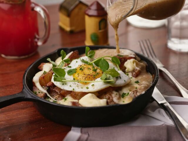 Start your day the delicious way! Join us at Honey Salt for brunch and indulge in our Breakfast Poutine—herb roasted potatoes, bacon gravy, smoked bacon, cheese curds, and a sunny side farm egg to top it all off!