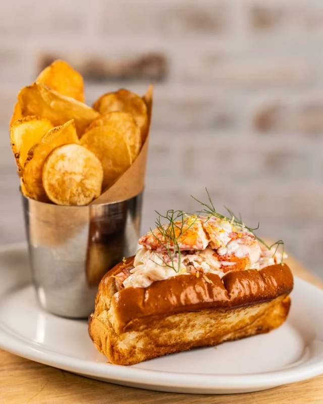 Welcome back to our Lobster Roll!🦞 An ode to Chef @kim_canteenwalla and @elizabethblau‘s love for Cape Code, our Lobster Roll holds a special place on the menu. A mouthwatering blend of tender lobster, crisp fennel, celery, tarragon and a tangy lemon aioli are mixed together and topped with a crunchy finish of salted potato chips then placed between a buttery brioche bun.
 
It’s bright, fresh, and made for spring days on the patio.🍋⚓️☀️